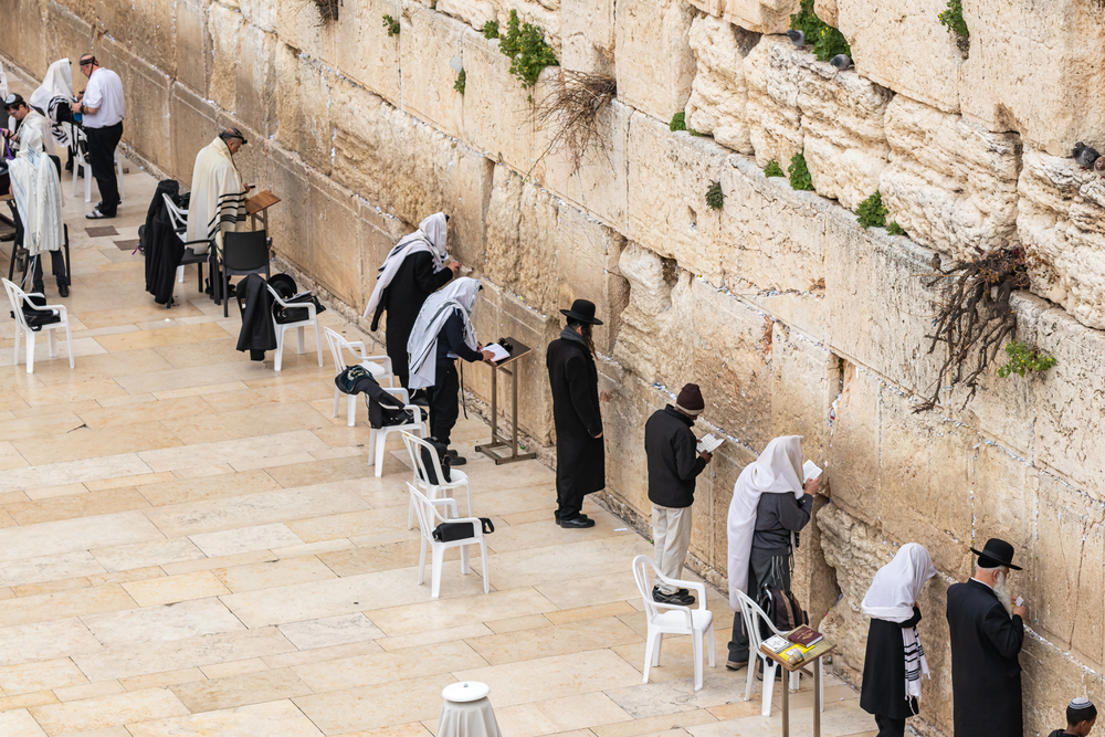 Jerusalem, Israel, March 3, 2020 : Jewish believers pray near the Kotel in the Old Town of Jerusalem in Israel